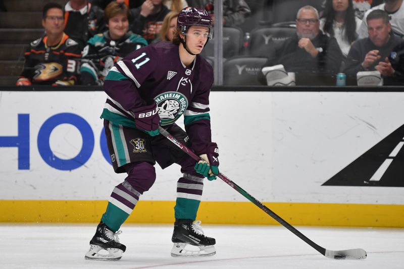 Dec 23, 2023; Anaheim, California, USA; Anaheim Ducks center Trevor Zegras (11) moves the puck against the Seattle Kraken during the second period at Honda Center. Mandatory Credit: Gary A. Vasquez-USA TODAY Sports