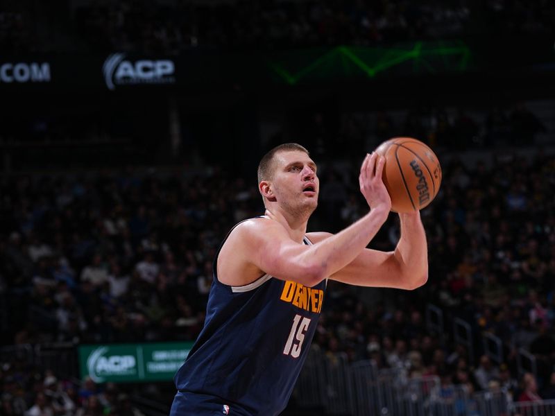 DENVER, CO - MARCH 25: Nikola Jokic #15 of the Denver Nuggets shoots the ball during the game against the Memphis Grizzlies on March 25, 2024 at the Ball Arena in Denver, Colorado. NOTE TO USER: User expressly acknowledges and agrees that, by downloading and/or using this Photograph, user is consenting to the terms and conditions of the Getty Images License Agreement. Mandatory Copyright Notice: Copyright 2024 NBAE (Photo by Bart Young/NBAE via Getty Images)