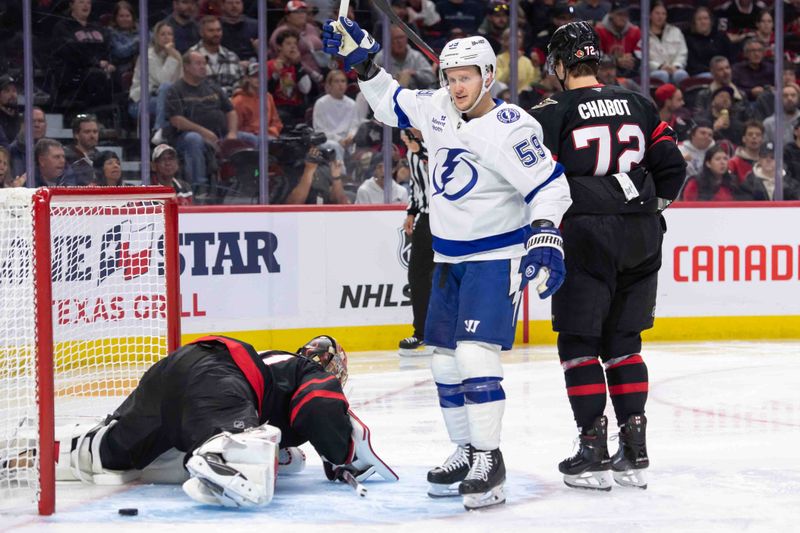 Oct 19, 2024; Ottawa, Ontario, CAN; Tampa Bay Lightning center Jake Guentzel (59) celebrates a goal scored by right wing Nikita Kucherov (86-not pictured) in the second period against the Ottawa Senators at the Canadian Tire Centre. Mandatory Credit: Marc DesRosiers-Imagn Images