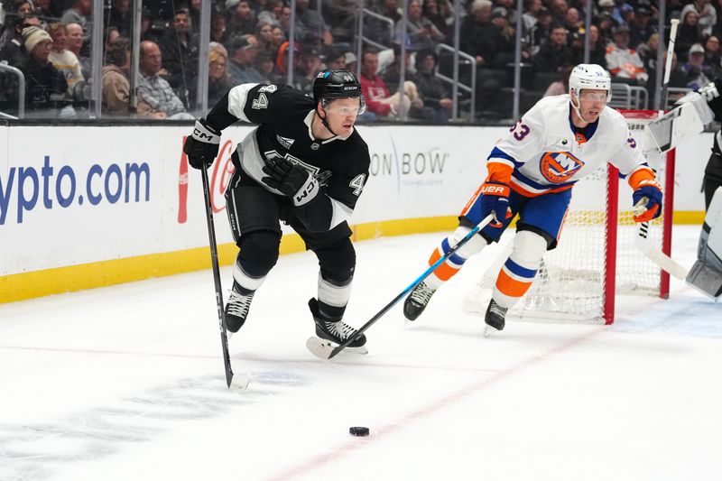 Mar 5, 2026; Los Angeles, California, USA; LA Kings defenseman Mikey Anderson (44) skates against New York Islanders center Casey Cizikas (53) in the first period at Crypto.com Arena. Mandatory Credit: Kirby Lee-Imagn Images