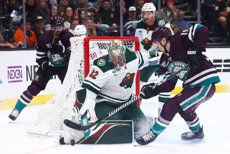 Mar 19, 2024; Anaheim, California, USA; Minnesota Wild goaltender Filip Gustavsson (32) makes a save against Anaheim Ducks right wing Troy Terry (19) during the second period of a game at Honda Center. Mandatory Credit: Jessica Alcheh-USA TODAY Sports