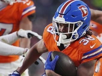 Denver Broncos running back Jaleel McLaughlin (38) runs the ball against the Kansas City Chiefs during an NFL football game, Sunday, Jan. 5, 2025 in Denver. (AP Photo/Bart Young)