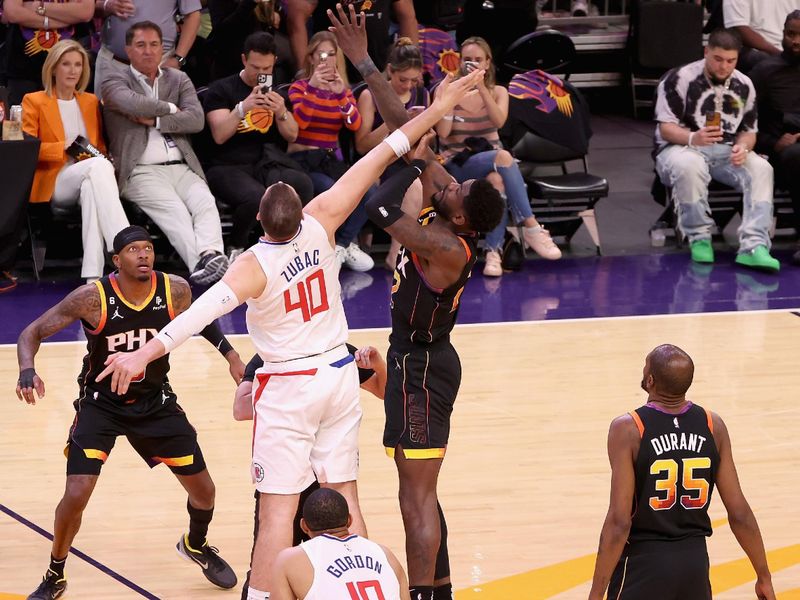 PHOENIX, ARIZONA - APRIL 18: Deandre Ayton #22 of the Phoenix Suns and Ivica Zubac #40 of the LA Clippers reach for the opening tip during Game Two of the Western Conference First Round Playoffs at Footprint Center on April 18, 2023 in Phoenix, Arizona. (Photo by Christian Petersen/Getty Images)