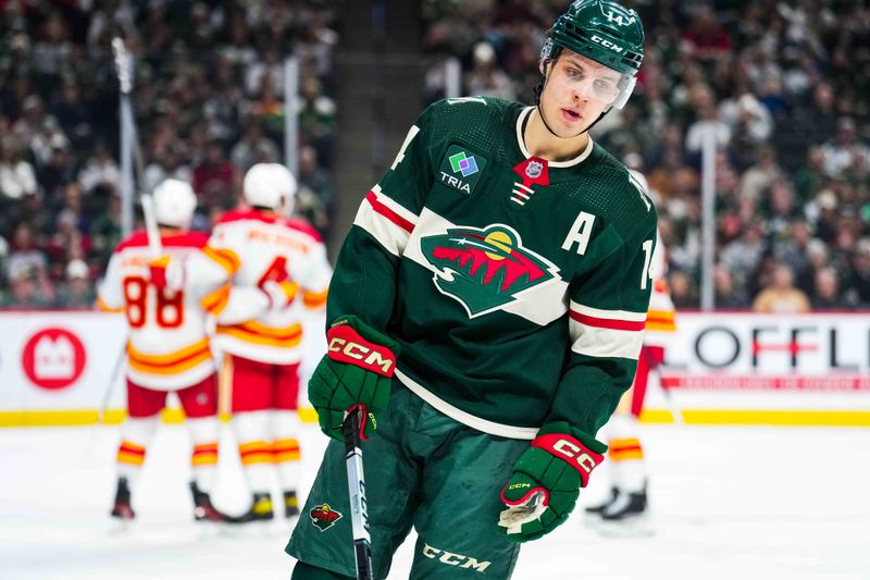 Jan 2, 2024; Saint Paul, Minnesota, USA; Minnesota Wild center Joel Eriksson Ek (14) looks on after allowing a goal during the first period against the Calgary Flames at Xcel Energy Center. Mandatory Credit: Brace Hemmelgarn-USA TODAY Sports