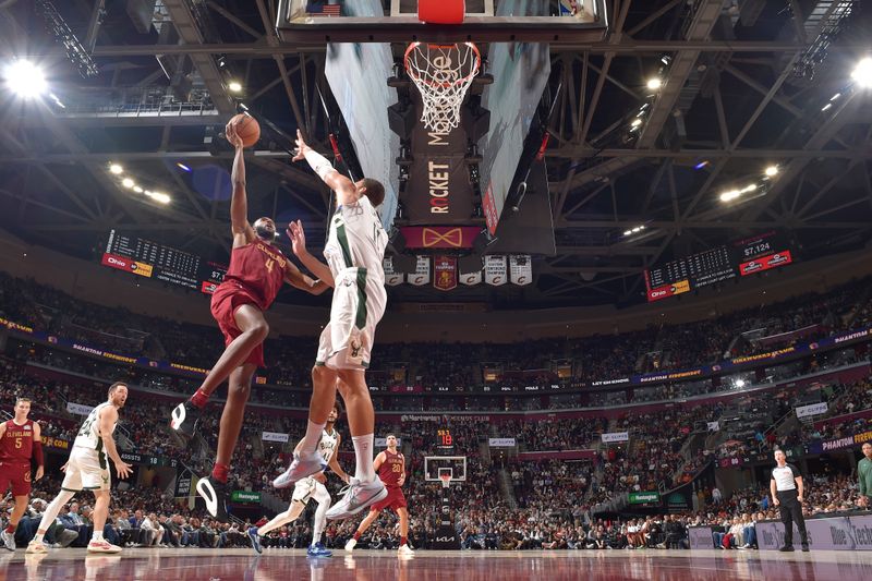 CLEVELAND, OH - NOVEMBER 4: Evan Mobley #4 of the Cleveland Cavaliers drives to the basket during the game against the Milwaukee Bucks on November 4, 2024 at Rocket Mortgage FieldHouse in Cleveland, Ohio. NOTE TO USER: User expressly acknowledges and agrees that, by downloading and/or using this Photograph, user is consenting to the terms and conditions of the Getty Images License Agreement. Mandatory Copyright Notice: Copyright 2024 NBAE (Photo by David Liam Kyle/NBAE via Getty Images)