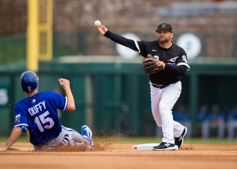 Mar 22, 2023; Phoenix, Arizona, USA; Chicago White Sox infielder Nate Mondou (right) throws to first to complete the double play after forcing out sliding Kansas City Royals base runner Matt Duffy during a spring training game at Camelback Ranch-Glendale. Mandatory Credit: Mark J. Rebilas-USA TODAY Sports