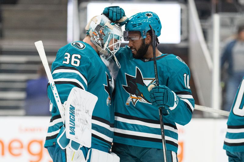 Sep 24, 2023; San Jose, California, USA;  San Jose Sharks left wing Anthony Duclair (10) congratulates goalie Kaapo Kahkonen after defeating the Vegas Golden Knights at SAP Center at San Jose. Mandatory Credit: Stan Szeto-USA TODAY Sports