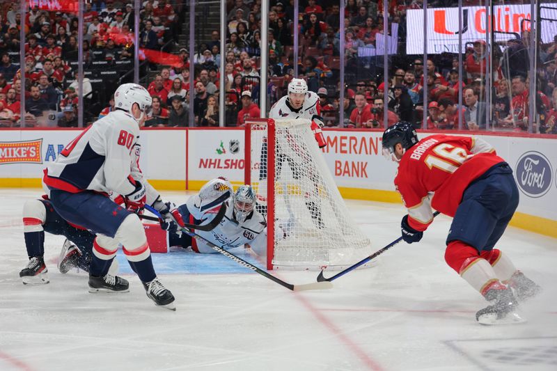 Nov 25, 2024; Sunrise, Florida, USA; Washington Capitals goaltender Logan Thompson (48) makes a save against Florida Panthers center Aleksander Barkov (16) during the second period at Amerant Bank Arena. Mandatory Credit: Sam Navarro-Imagn Images