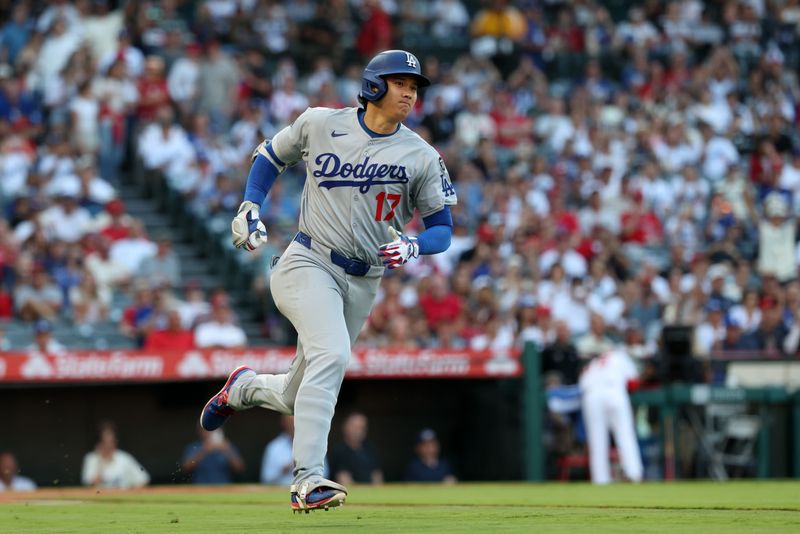 Aug 13, 2025; Anaheim, California, USA;  Los Angeles Dodgers two-way player Shohei Ohtani (17) runs around bases on a triple during the first inning against the Los Angeles Angels at Angel Stadium. Mandatory Credit: Kiyoshi Mio-Imagn Images