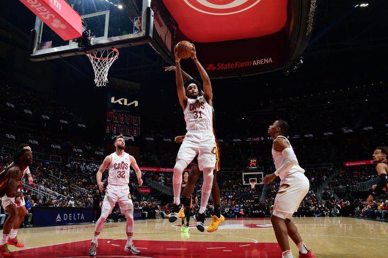 ATLANTA, GA - JANUARY 20: Jarrett Allen #31 of the Cleveland Cavaliers grabs a rebound during the game against the Atlanta Hawks on January 20, 2024 at State Farm Arena in Atlanta, Georgia.  NOTE TO USER: User expressly acknowledges and agrees that, by downloading and/or using this Photograph, user is consenting to the terms and conditions of the Getty Images License Agreement. Mandatory Copyright Notice: Copyright 2024 NBAE (Photo by Scott Cunningham/NBAE via Getty Images)