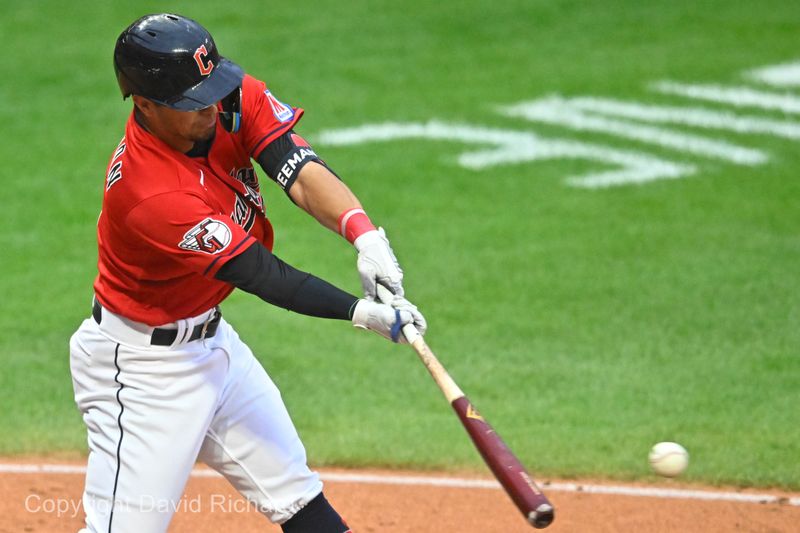 Sep 27, 2023; Cleveland, Ohio, USA; Cleveland Guardians second baseman Tyler Freeman (2) hits an RBI single in the second inning against the Cincinnati Reds at Progressive Field. Mandatory Credit: David Richard-USA TODAY Sports