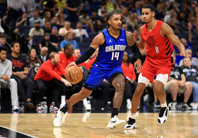 ORLANDO, FLORIDA - APRIL 01: Gary Harris #14 of the Orlando Magic drives on  Kris Murray #8 of the Portland Trail Blazersduring a game  at Kia Center on April 01, 2024 in Orlando, Florida. NOTE TO USER: User expressly acknowledges and agrees that, by downloading and or using this photograph, User is consenting to the terms and conditions of the Getty Images License Agreement. (Photo by Mike Ehrmann/Getty Images)