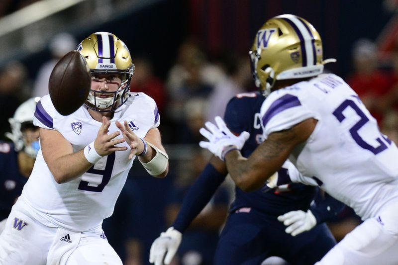 Oct 22, 2021; Tucson, Arizona, USA; Washington Huskies quarterback Dylan Morris (9) pitches to Washington Huskies running back Cameron Davis (22) during the second half at Arizona Stadium. Mandatory Credit: Joe Camporeale-USA TODAY Sports