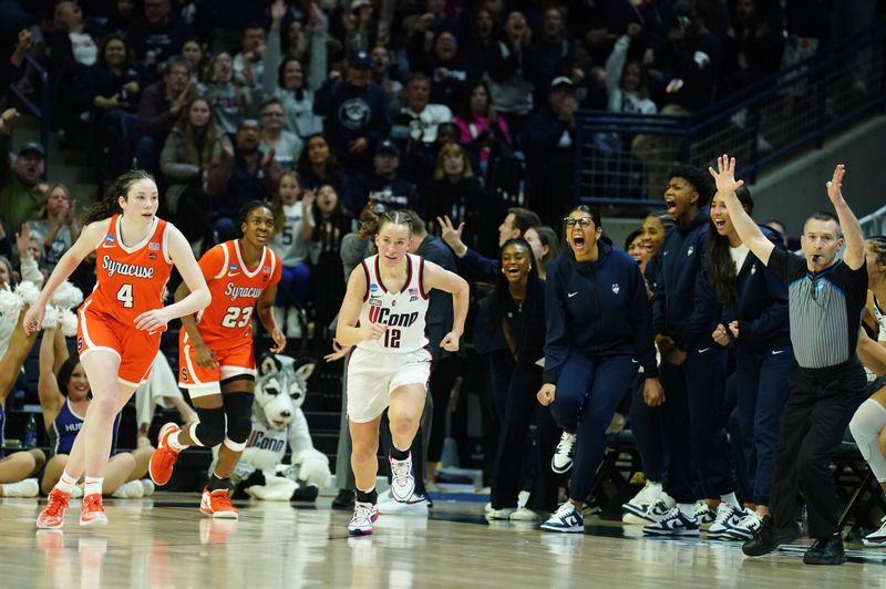 Mar 25, 2024; Storrs, Connecticut, USA; UConn Huskies guard Ashlynn Shade (12) shoots a three point basket against the Syracuse Orange in the second half at Harry A. Gampel Pavilion. Mandatory Credit: David Butler II-USA TODAY Sports