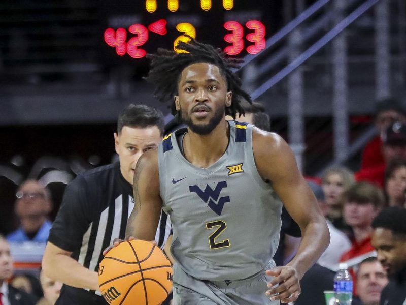 Mar 9, 2024; Cincinnati, Ohio, USA; West Virginia Mountaineers guard Kobe Johnson (2) dribbles against the Cincinnati Bearcats in the second half at Fifth Third Arena. Mandatory Credit: Katie Stratman-USA TODAY Sports