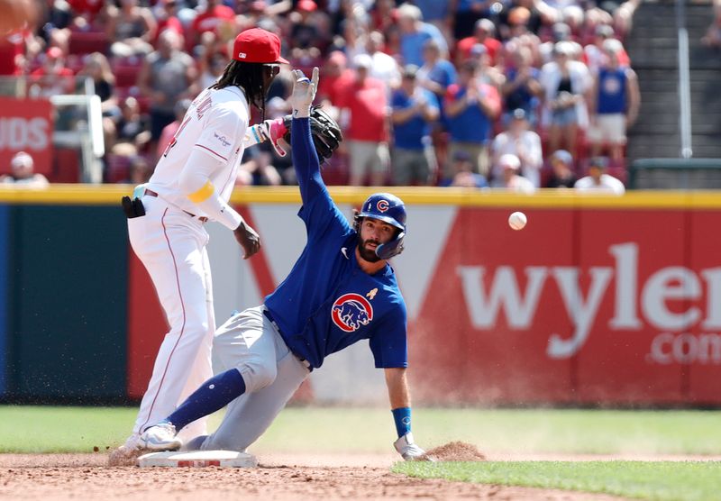 Sep 3, 2023; Cincinnati, Ohio, USA; Chicago Cubs shortstop Dansby Swanson (7) is safe at second against Cincinnati Reds third baseman Elly De La Cruz (44) after hitting a two-run double during the eighth inning at Great American Ball Park. Mandatory Credit: David Kohl-USA TODAY Sports