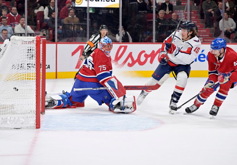 Nov 20, 2025; Montreal, Quebec, CAN; Washington Capitals forward Sonny Milano (15) scores a goal against Montreal Canadiens goalie Jakub Dobes (75) during the second period at the Bell Centre. Mandatory Credit: Eric Bolte-Imagn Images