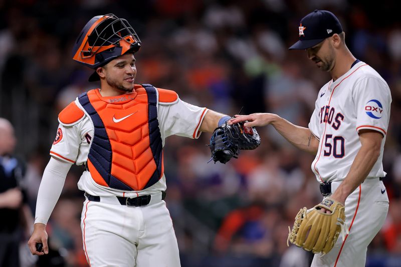 May 14, 2024; Houston, Texas, USA; Houston Astros relief pitcher Tayler Scott (50) is greeted by Houston Astros catcher Yainer Diaz (21) after retiring the side against the Oakland Athletics during the fifth inning at Minute Maid Park. Mandatory Credit: Erik Williams-USA TODAY Sports