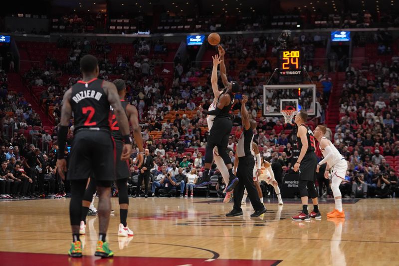 MIAMI, FL - APRIL 2: Bam Adebayo #13 of the Miami Heat goes for the opening tip off during the game against the New York Knicks on April 2, 2024 at Kaseya Center in Miami, Florida. NOTE TO USER: User expressly acknowledges and agrees that, by downloading and or using this Photograph, user is consenting to the terms and conditions of the Getty Images License Agreement. Mandatory Copyright Notice: Copyright 2024 NBAE (Photo by Eric Espada/NBAE via Getty Images)