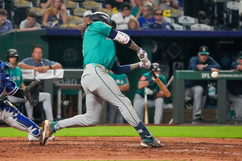 Sep 17, 2025; Kansas City, Missouri, USA; Seattle Mariners shortstop J.P. Crawford (3) hits a solo home run against the Seattle Mariners during the eighth inning at Kauffman Stadium. Mandatory Credit: Denny Medley-Imagn Images