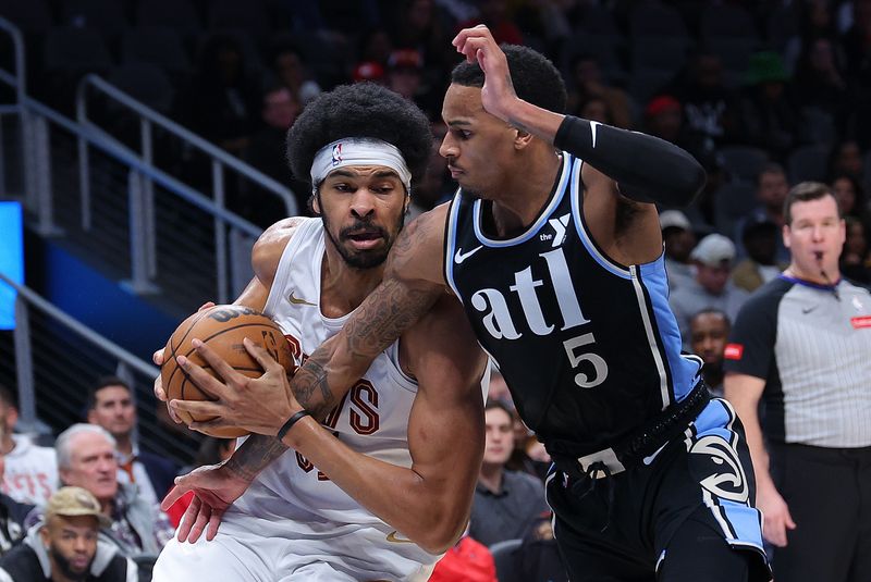 ATLANTA, GEORGIA - MARCH 06:  Dejounte Murray #5 of the Atlanta Hawks defends against Jarrett Allen #31 of the Cleveland Cavaliers during the first quarter at State Farm Arena on March 06, 2024 in Atlanta, Georgia.  NOTE TO USER: User expressly acknowledges and agrees that, by downloading and/or using this photograph, user is consenting to the terms and conditions of the Getty Images License Agreement.  (Photo by Kevin C. Cox/Getty Images)