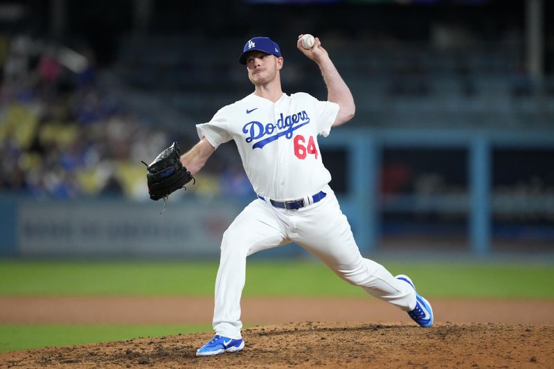 Jun 15, 2023; Los Angeles, California, USA; Los Angeles Dodgers relief pitcher Caleb Ferguson (64) throws in the 11th inning against the Chicago White Sox at Dodger Stadium. Mandatory Credit: Kirby Lee-USA TODAY Sports