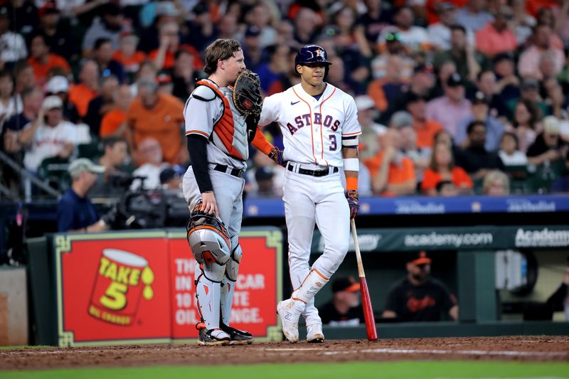 Sep 20, 2023; Houston, Texas, USA; Baltimore Orioles catcher Adley Rutschman (35) talks with Houston Astros shortstop Jeremy Pena (3) during a break in the action during the sixth inning at Minute Maid Park. Mandatory Credit: Erik Williams-USA TODAY Sports