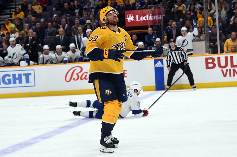 Dec 7, 2023; Nashville, Tennessee, USA; Nashville Predators defenseman Roman Josi (59) reacts after being called for a trip on Tampa Bay Lightning right wing Nikita Kucherov (86) during the second period at Bridgestone Arena. Mandatory Credit: Christopher Hanewinckel-USA TODAY Sports