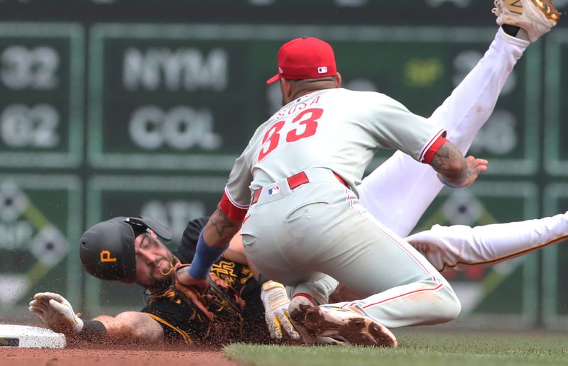 Jun 7, 2025; Pittsburgh, Pennsylvania, USA;  Philadelphia Phillies second baseman Edmundo Sosa (33) tags Pittsburgh Pirates first baseman Jared Triolo (19) out at second base on a steal attempt during the fifth inning at PNC Park. Mandatory Credit: Charles LeClaire-Imagn Images