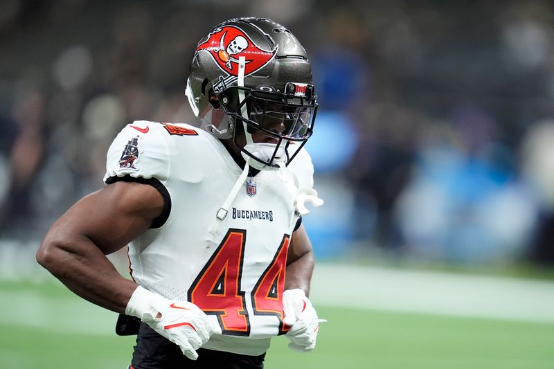 Tampa Bay Buccaneers running back Sean Tucker (44) warms up before an NFL football game against the New Orleans Saints in New Orleans, Sunday, Oct. 13, 2024. (AP Photo/Michael Conroy)