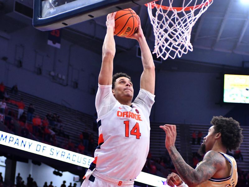 Feb 28, 2023; Syracuse, New York, USA; Syracuse Orange center Jesse Edwards (14) dunks the ball over Georgia Tech Yellow Jackets forward Jalon Moore (14) in the second half at the JMA Wireless Dome. Mandatory Credit: Mark Konezny-USA TODAY Sports