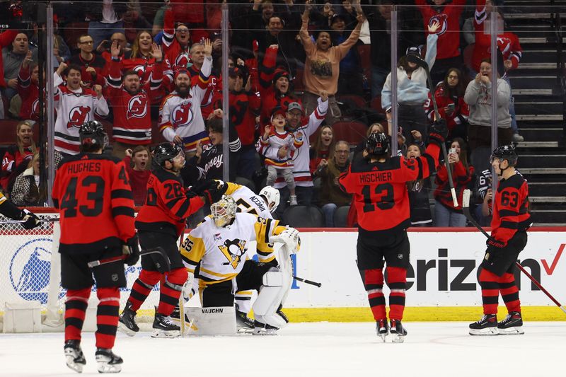 Mar 19, 2024; Newark, New Jersey, USA; New Jersey Devils right wing Timo Meier (28) celebrates his goal against the Pittsburgh Penguins during the third period at Prudential Center. Mandatory Credit: Ed Mulholland-USA TODAY Sports