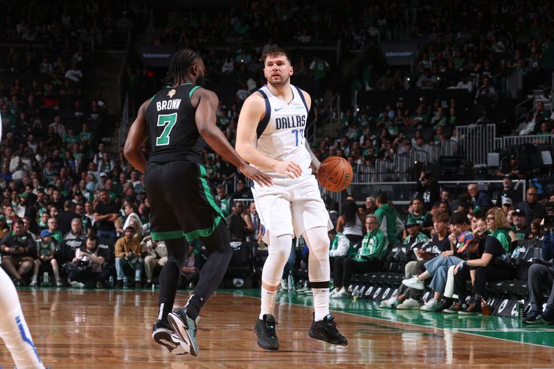 BOSTON, MA - JUNE 9: Luka Doncic #77 of the Dallas Mavericks dribbles the ball during the game against the Boston Celtics during Game 1 of the 2024 NBA Finals on June 9, 2024 at the TD Garden in Boston, Massachusetts. NOTE TO USER: User expressly acknowledges and agrees that, by downloading and or using this photograph, User is consenting to the terms and conditions of the Getty Images License Agreement. Mandatory Copyright Notice: Copyright 2024 NBAE  (Photo by Nathaniel S. Butler/NBAE via Getty Images)