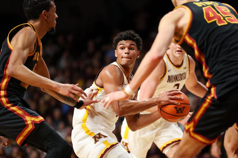 Jan 9, 2026; Minneapolis, Minnesota, USA; Minnesota Golden Gophers guard Isaac Asuma (1) looks to shoot against the Southern California Trojans during the first half at Williams Arena. Mandatory Credit: Matt Krohn-Imagn Images