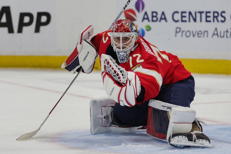 Oct 17, 2024; Sunrise, Florida, USA; Florida Panthers goaltender Sergei Bobrovsky (72) makes a save against the Vancouver Canucks during the second period at Amerant Bank Arena. Mandatory Credit: Sam Navarro-Imagn Images