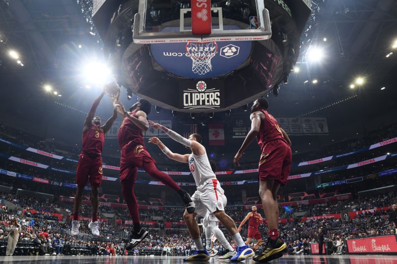 LOS ANGELES, CA - APRIL 7: Caris LeVert #3 of the Cleveland Cavaliers goes up for the rebound during the game against the LA Clippers on April 7, 2024 at Crypto.Com Arena in Los Angeles, California. NOTE TO USER: User expressly acknowledges and agrees that, by downloading and/or using this Photograph, user is consenting to the terms and conditions of the Getty Images License Agreement. Mandatory Copyright Notice: Copyright 2024 NBAE (Photo by Adam Pantozzi/NBAE via Getty Images)