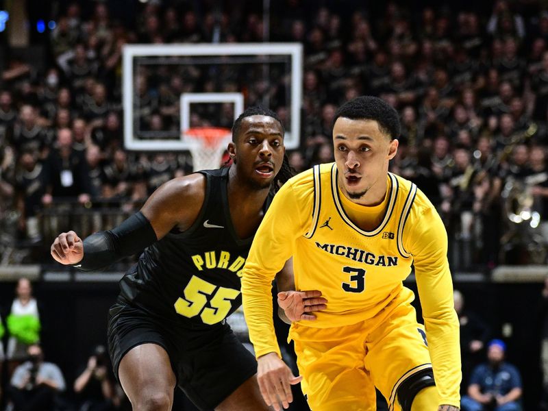 Jan 23, 2024; West Lafayette, Indiana, USA; Michigan Wolverines guard Jaelin Llewellyn (3) drives the ball past Purdue Boilermakers guard Lance Jones (55) during the first half at Mackey Arena. Mandatory Credit: Marc Lebryk-USA TODAY Sports