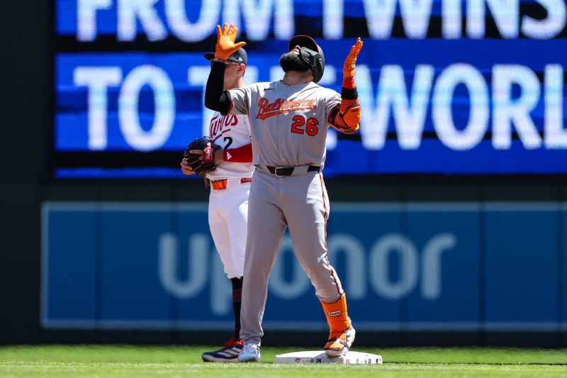 May 8, 2025; Minneapolis, Minnesota, USA; Baltimore Orioles third baseman Emmanuel Rivera (26) celebrates his RBI double against the Minnesota Twins during the second inning at Target Field. Mandatory Credit: Matt Krohn-Imagn Images