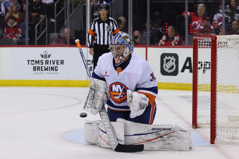 Oct 25, 2024; Newark, New Jersey, USA; New York Islanders goaltender Ilya Sorokin (30) makes a save against the New Jersey Devils during the second period at Prudential Center. Mandatory Credit: Ed Mulholland-Imagn Images