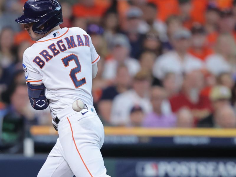 Oct 7, 2023; Houston, Texas, USA; Houston Astros third baseman Alex Bregman (2) is hit by a pitch in the third inning against the Minnesota Twins during game one of the ALDS for the 2023 MLB playoffs at Minute Maid Park. Mandatory Credit: Erik Williams-USA TODAY Sports