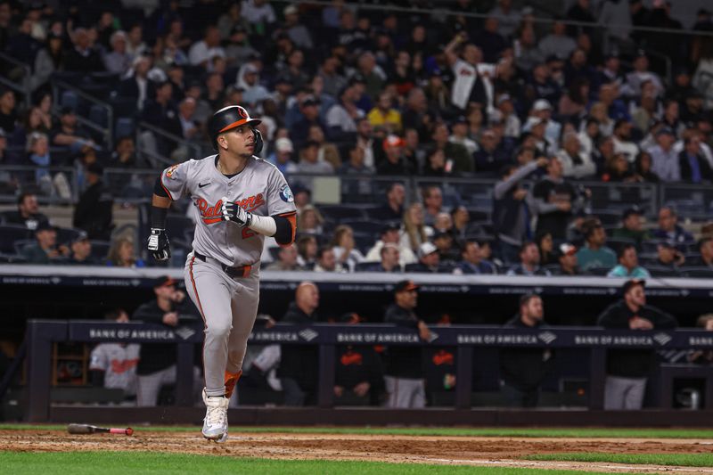 Sep 24, 2024; Bronx, New York, USA; Baltimore Orioles third baseman Ramon Urias (29) looks up at his solo home run during the seventh inning against the New York Yankees at Yankee Stadium. Mandatory Credit: Vincent Carchietta-Imagn Images