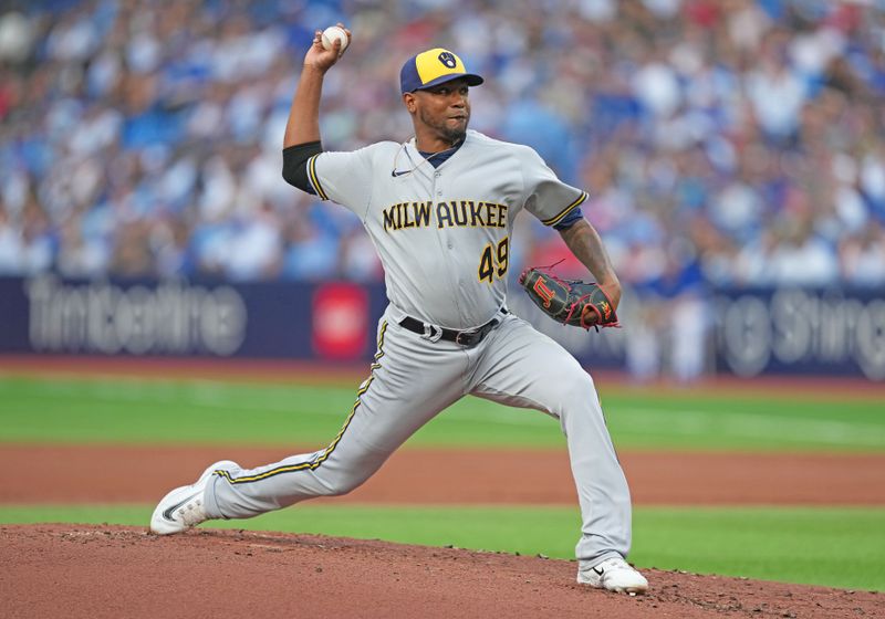 May 31, 2023; Toronto, Ontario, CAN; Milwaukee Brewers starting pitcher Julio Teheran (49) throws a pitch against the Toronto Blue Jays during the first inning at Rogers Centre. Mandatory Credit: Nick Turchiaro-USA TODAY Sports