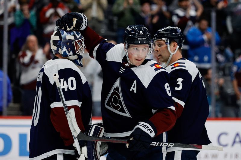 Apr 9, 2024; Denver, Colorado, USA; Colorado Avalanche defenseman Cale Makar (8) and defenseman Jack Johnson (3) react with goaltender Alexandar Georgiev (40) after the game against the Minnesota Wild at Ball Arena. Mandatory Credit: Isaiah J. Downing-USA TODAY Sports