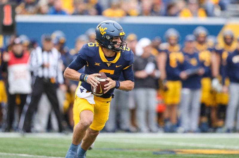 Oct 21, 2023; Morgantown, West Virginia, USA; West Virginia Mountaineers quarterback Garrett Greene (6) rolls out for a pass against the Oklahoma State Cowboys during the second quarter at Mountaineer Field at Milan Puskar Stadium. Mandatory Credit: Ben Queen-USA TODAY Sports