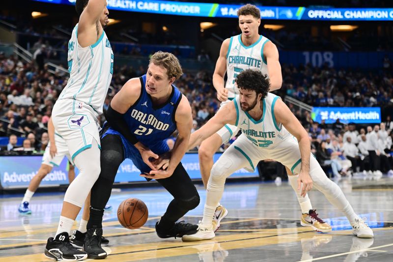 ORLANDO, FLORIDA - NOVEMBER 12: Vasilije Micic #22 of the Charlotte Hornets steals the ball from Moritz Wagner #21 of the Orlando Magic in the second half during an Emirates NBA Cup game at Kia Center on November 12, 2024 in Orlando, Florida. NOTE TO USER: User expressly acknowledges and agrees that, by downloading and or using this photograph, User is consenting to the terms and conditions of the Getty Images License Agreement. (Photo by Julio Aguilar/Getty Images)