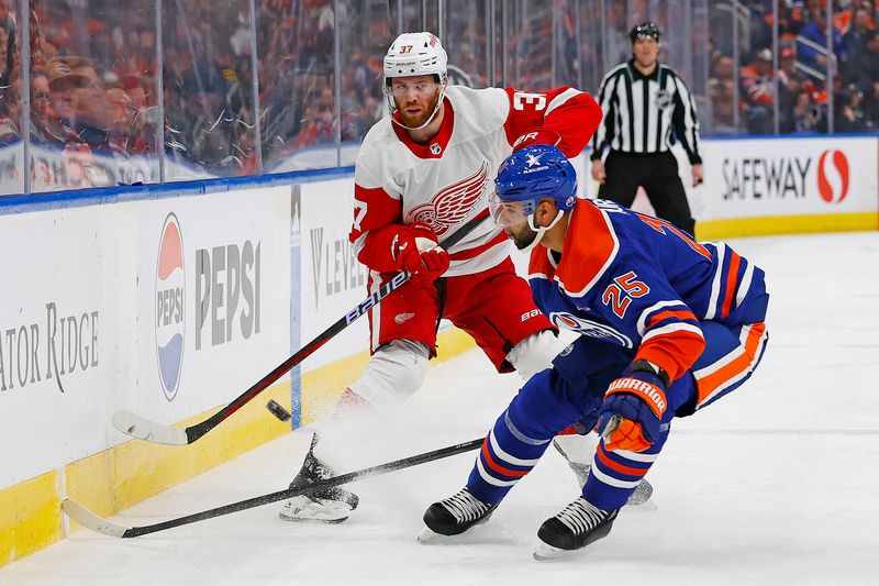 Feb 13, 2024; Edmonton, Alberta, CAN;Detroit Red Wings forward J.T. Compher (37) chips the puck past Edmonton Oilers defensemen Darnell Nurse (25) during the second period  at Rogers Place. Mandatory Credit: Perry Nelson-USA TODAY Sports