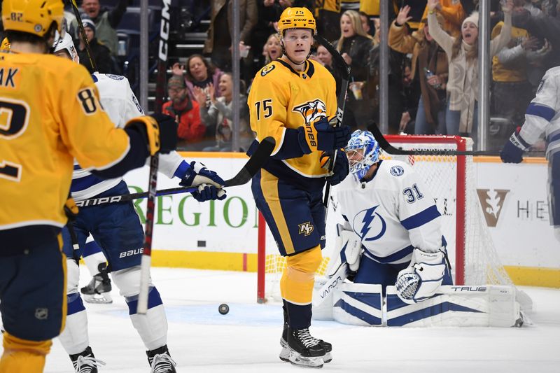 Dec 3, 2023; Nashville, Tennessee, USA; Nashville Predators center Juuso Parssinen (75) celebrates after a goal during the first period against the Tampa Bay Lightning at Bridgestone Arena. Mandatory Credit: Christopher Hanewinckel-USA TODAY Sports