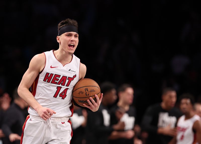 NEW YORK, NEW YORK - JANUARY 15:  Tyler Herro #14 of the Miami Heat celebrates a 95-94 overtime win against the Brooklyn Nets during their game at Barclays Center on January 15, 2024 in New York City.   User expressly acknowledges and agrees that, by downloading and or using this photograph, User is consenting to the terms and conditions of the Getty Images License Agreement.  (Photo by Al Bello/Getty Images)