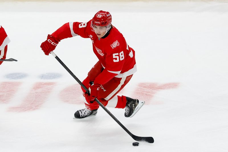 Mar 4, 2026; Detroit, Michigan, USA;  Detroit Red Wings center Emmitt Finnie (58) skates with the puck in the first period against the Vegas Golden Knights at Little Caesars Arena. Mandatory Credit: Rick Osentoski-Imagn Images