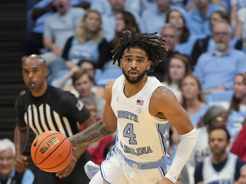 Nov 6, 2023; Chapel Hill, North Carolina, USA;  North Carolina Tar Heels guard RJ Davis (4) brings the ball up the court in the second half at Dean E. Smith Center. Mandatory Credit: Bob Donnan-USA TODAY Sports